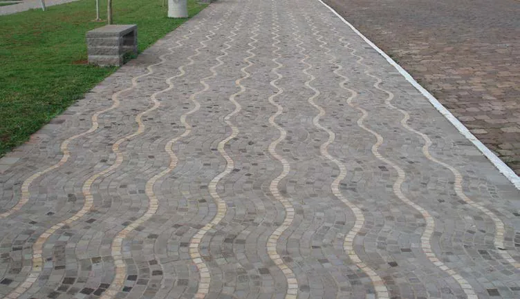 Stone-paved path with a two-tone wave pattern